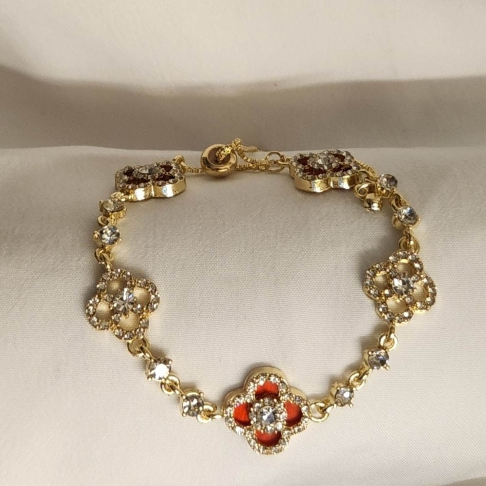 Elegant Gold and Red Iced Clover Bracelet